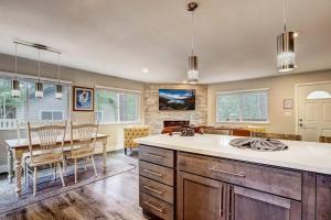 a kitchen with a table and a dining room at Bear Cub Cabin - Pets - Hot tub - Arcade Game in Mevers