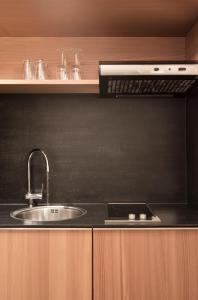 Kuchyň nebo kuchyňský kout v ubytování Hotel Manggei Designhotel Obertauern