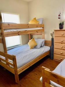 a bedroom with a wooden bunk bed with at Grand isle Detached Condo Unit F 3 bedrooms 1 bath Easy beach access pet ok in Grand Isle