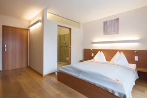 Postel nebo postele na pokoji v ubytování Hotel Manggei Designhotel Obertauern