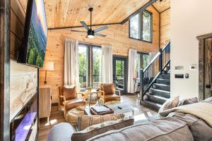 a living room with a couch and a table at Hot Tub, Games, Fireplace & Fast WiFi Near Dollywood in Sevierville