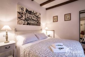 a bedroom with a bed with a tray on it at Green Apartments Rome in Rome