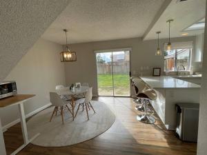 a kitchen and living room with a table and chairs at Pristine & Smart freshly remodeled house! in Lancaster
