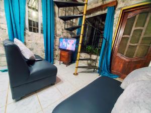 TV a/nebo společenská místnost v ubytování Cabaña monte de los olivos