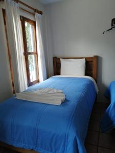 Postel nebo postele na pokoji v ubytování Posada Sancris
