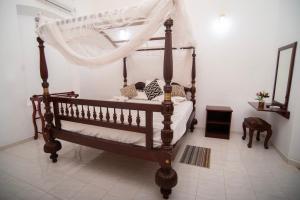 Postel nebo postele na pokoji v ubytování Heritage Samanthanna