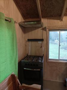 Kuchyň nebo kuchyňský kout v ubytování Cabaña Rancho JyC
