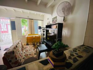 a living room with a couch and a table at Casa Mi Valle Loft in Santa Marta