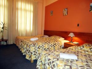 Cama ou camas em um quarto em Novo Bonbini