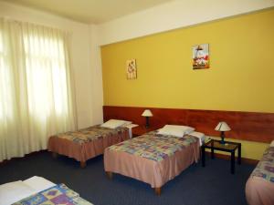 Cama ou camas em um quarto em Novo Bonbini
