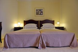 Postel nebo postele na pokoji v ubytování Dianthos Guesthouse