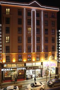 a hotel building with cars parked in front of it at Bianca Hotel VAN in Van