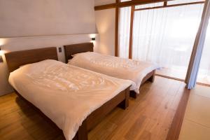 GuestHouseYULLAT客房内的一张或多张床位