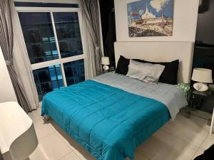 En eller flere senge i et værelse på City Center Residence Pattaya + 12 billeder