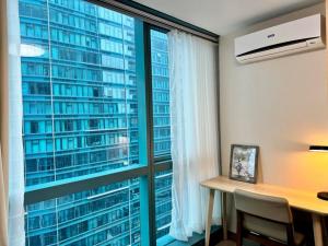 Foto Manilas asuva majutusasutuse BGC 1BR unit linked to Uptown Mall with own parking galeriist