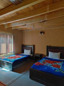 Postel nebo postele na pokoji v ubytování Passu Cones Hotel + 20 fotografií