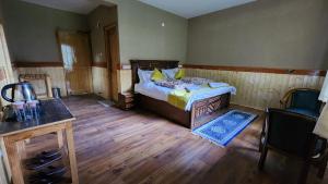 Postel nebo postele na pokoji v ubytování Hotel Gangchen Tabo