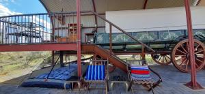 a playground with a green wagon with a slide at Willem Sternbergwa Adam se Uitspanning in Orania