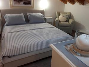 A bed or beds in a room at Locanda Bellavista