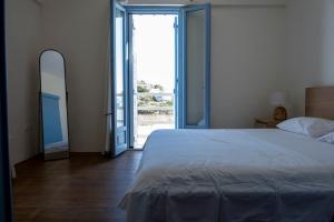 En eller flere senge i et værelse på AquaBlu Syros 5 + 32 billeder