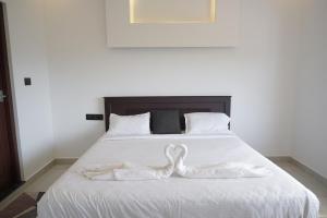 Postel nebo postele na pokoji v ubytování Highrange villas