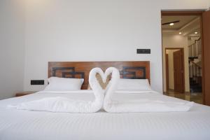 Postel nebo postele na pokoji v ubytování Highrange villas