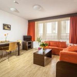 a living room with a couch and a table at Prater Residence Aparthotel in Budapest