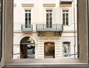 a view of a building from a window at La tua casa nel cuore di Torino in Turin