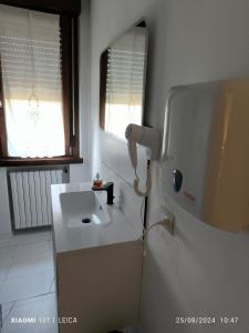 a bathroom with a sink and a mirror at Le piante di casa SaMar in Castelguelfo +27 photos