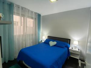 Posteľ alebo postele v izbe v ubytovaní Apartamento de playa familiar, piscina y garaje. + 26 fotografií