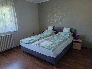 a bedroom with a bed in a room at Holiday home Balatonbereny - Balaton 18030 in Balatonberény
