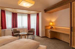 Voodi või voodid majutusasutuse Hotel Tyrol am Haldensee toas