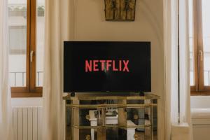 a television sitting on a table in a room at Piazza Erbe Luxury Apartment in Verona