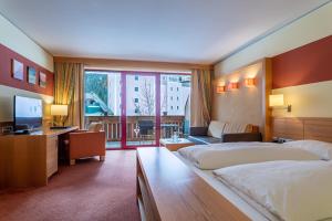 Voodi või voodid majutusasutuse Hotel Tyrol am Haldensee toas