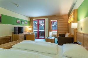 Voodi või voodid majutusasutuse Hotel Tyrol am Haldensee toas