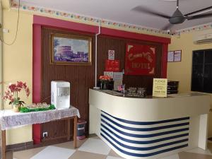 a bar in a restaurant with a counter with aperature at Casavilla Hotel in Taiping +9 photos
