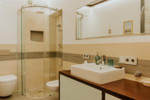 a bathroom with a sink and a glass shower at Lake House in Nago-Torbole +14 photos