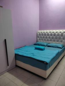 Postel nebo postele na pokoji v ubytování MyLittle Homestay