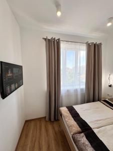 Katil atau katil-katil dalam bilik di White Apartment Melnyka10