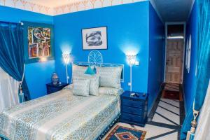 מיטה או מיטות בחדר ב-Le Petit Riad Maison d'hôtes