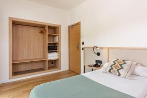 Postel nebo postele na pokoji v ubytování Copaiba by Honne Hotels - Adults Only