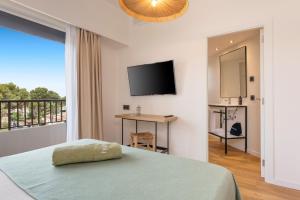 TV a/nebo společenská místnost v ubytování Copaiba by Honne Hotels - Adults Only