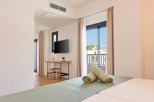 Postel nebo postele na pokoji v ubytování Copaiba by Honne Hotels - Adults Only