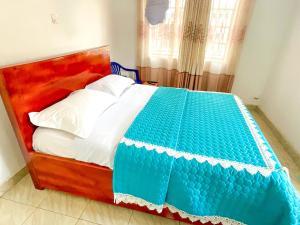Postel nebo postele na pokoji v ubytování Agape House Kisoro
