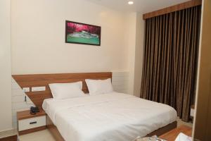 Postel nebo postele na pokoji v ubytování Hotel BR Grand
