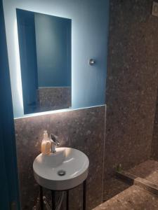 a bathroom with a sink and a mirror at Mp luxury houses Α3 in Larisa