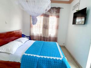Postel nebo postele na pokoji v ubytování Agape House Kisoro