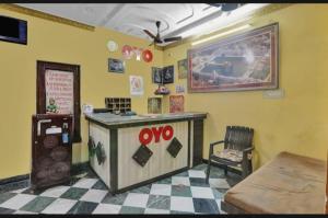 a restaurant with a counter and a checkered floor at Best hotel in Lucknow