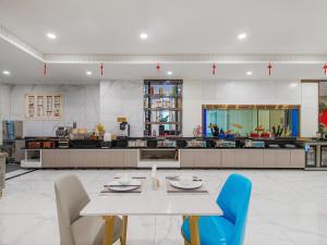 Restauracja lub miejsce do jedzenia w obiekcie 锦江都城 新沂行政中心北京路店