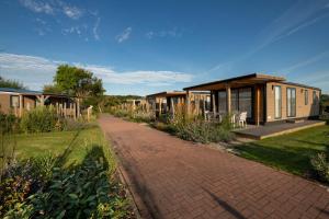 a row of mobile homes on a brick road at Beachside Vakantiepark in Blankenberge